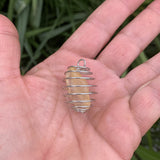 Natural citrine pendant in a cage, ideal for hanging on your pet's collar against depression 
