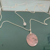 Natural rose quartz pendant with its silver chain