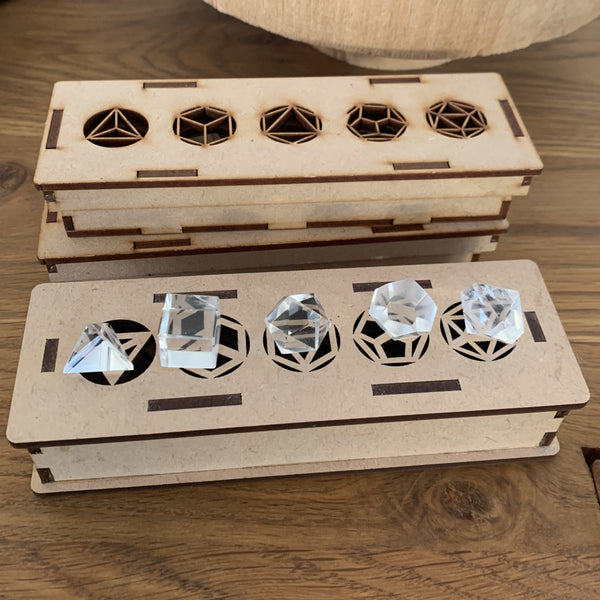 Platonic solids in extra rock crystal in their wooden box, on order